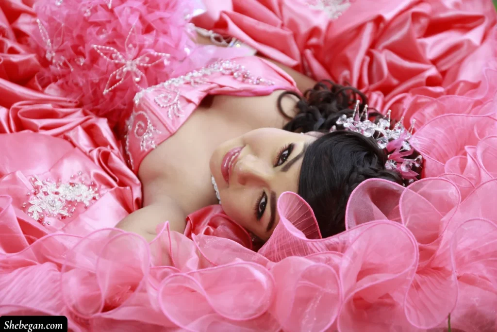 A lady wearing a pink dress