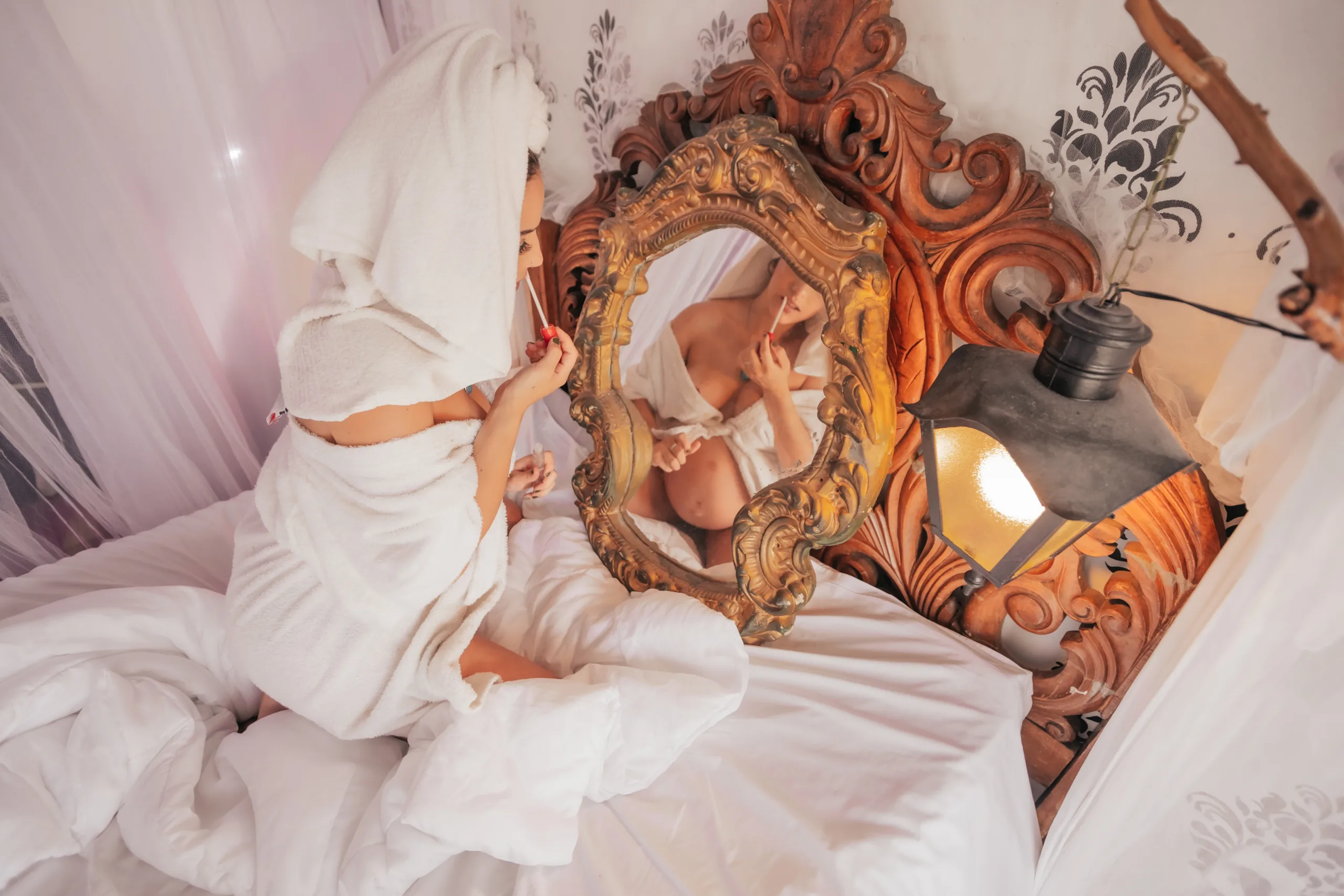 Pregnant women doing makeup 