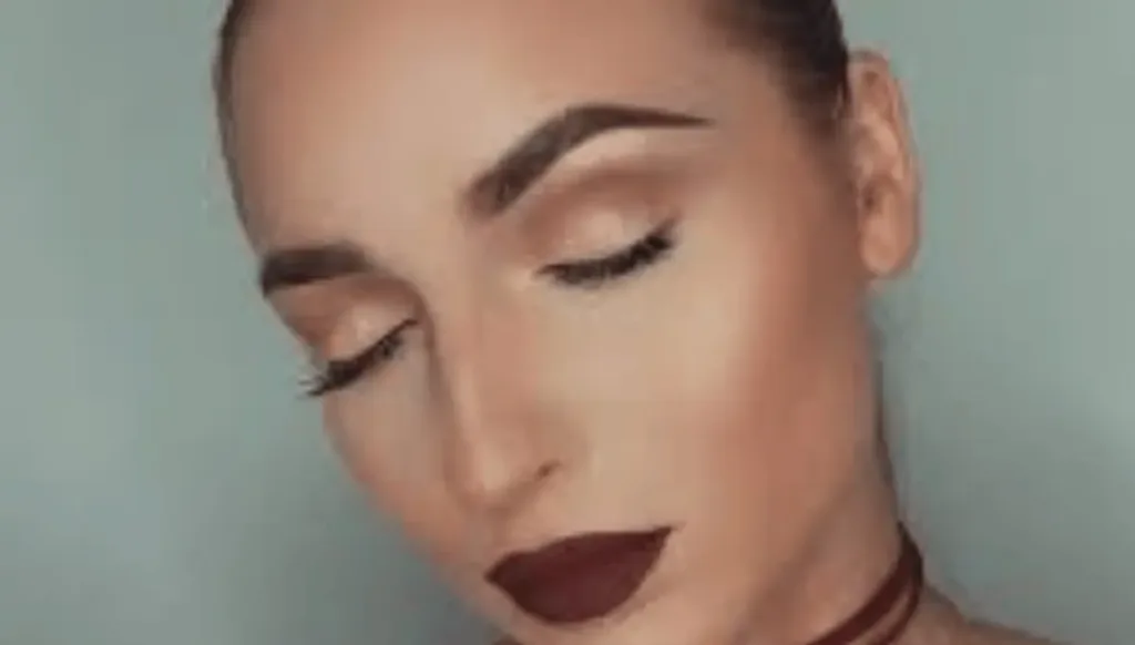 Brown and bronze eye makeup with burgundy lips