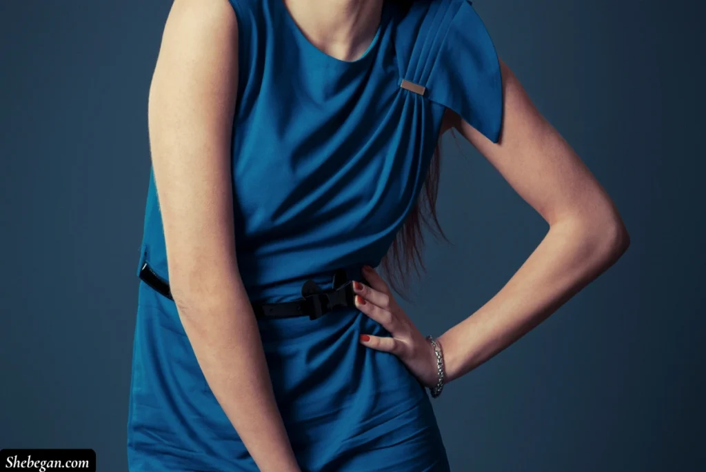 Teal blue dress with red nails