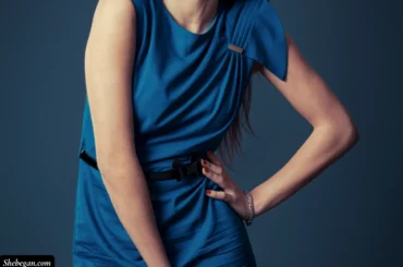 Teal blue dress with red nails